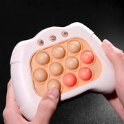 Pop It Push Popper Game sensory toy shaped like a game controller with soft silicone bubbles for stress relief and focus improvement.