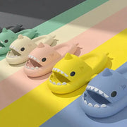 Shark Themed Pool Slides in multiple colors including yellow, pink, blue, and green, designed for fun and comfort during summer activities.