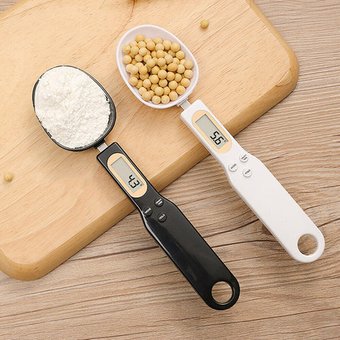 Digital Measuring Spoon Scale with LCD display in black and white, accurately weighing red and green beans for cooking and baking precision.